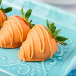 Chocolate Covered Strawberry Carrots on a blue serving platter