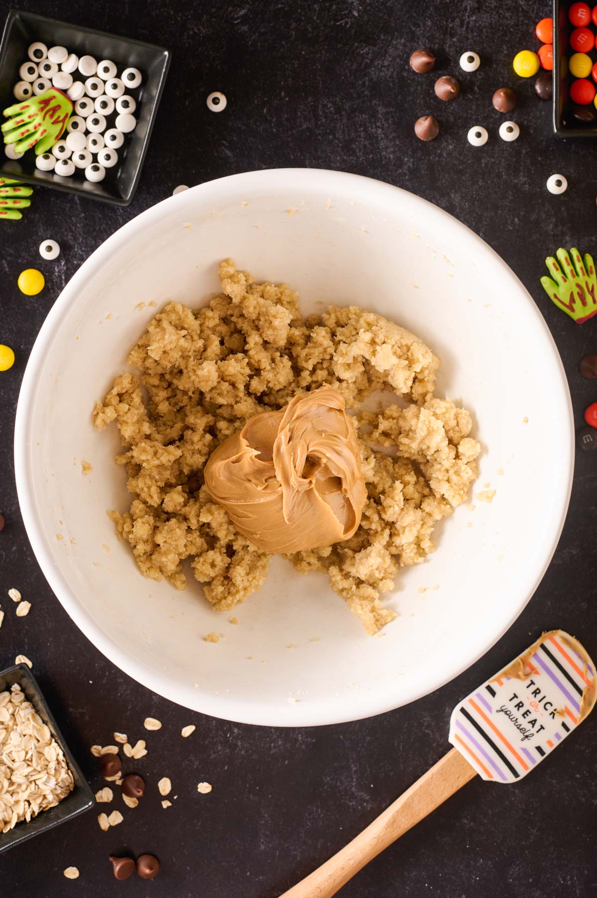 a mixing bowl with creamy peanut butter added to creamed butter and sugar