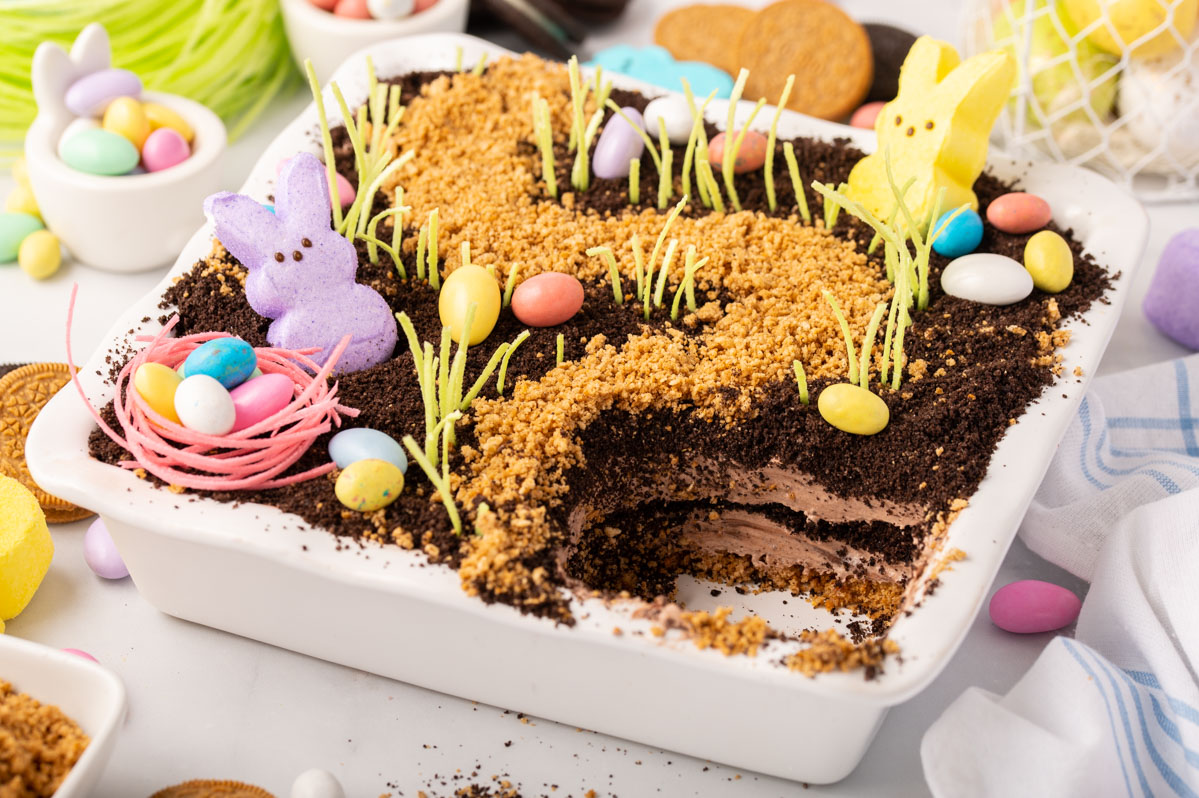 Easter dirt cake missing a scoop in the bottom right corner