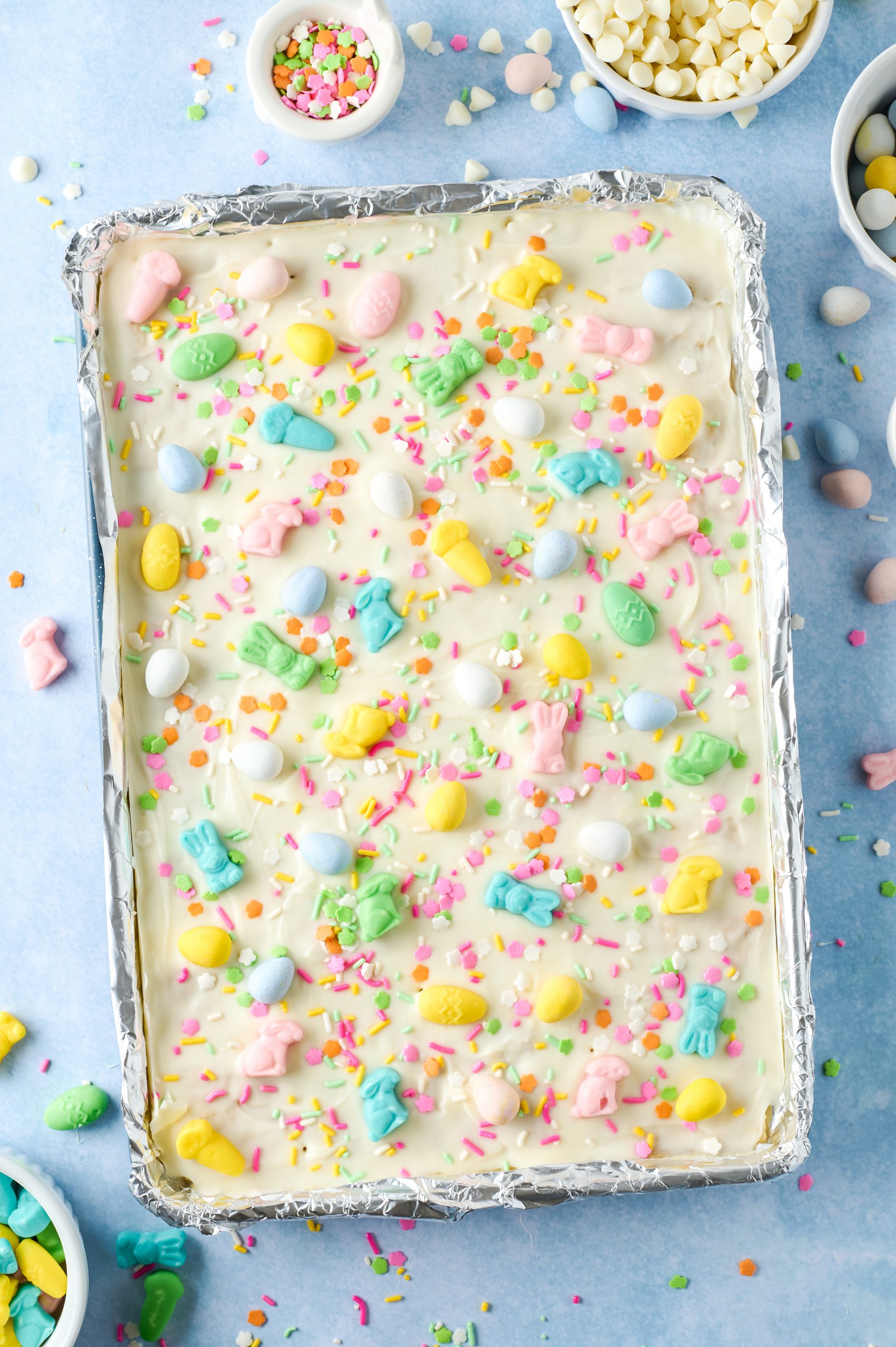 Easter saltine cracker toffee candy in a lipped baking sheet after chilling in the refrigerator for one hour