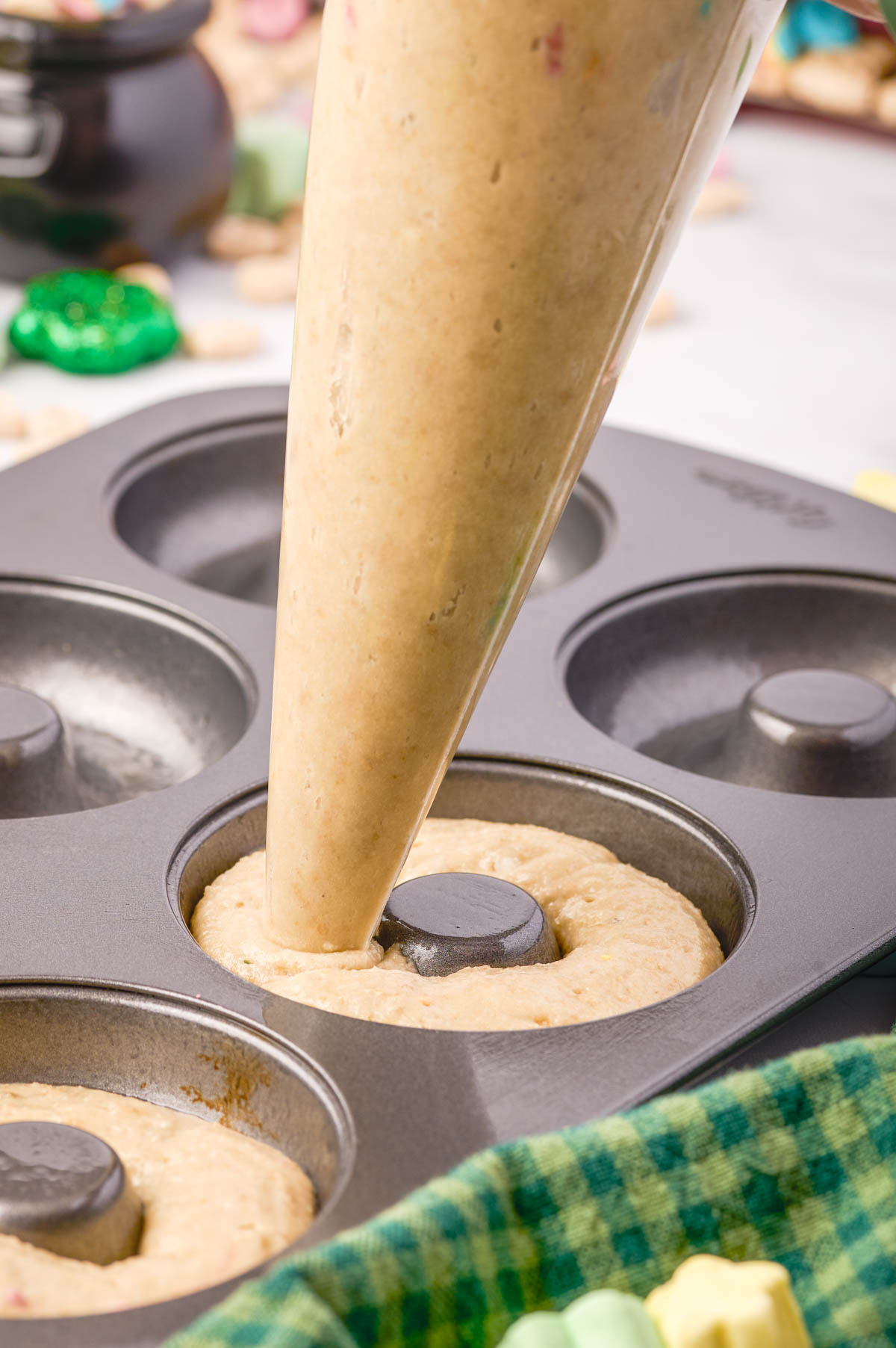 Piping batter into a donut pan