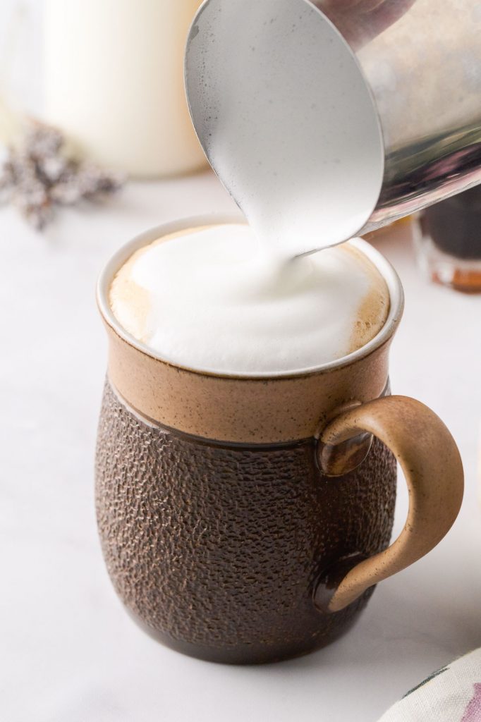 Steam milk foam topping a latte