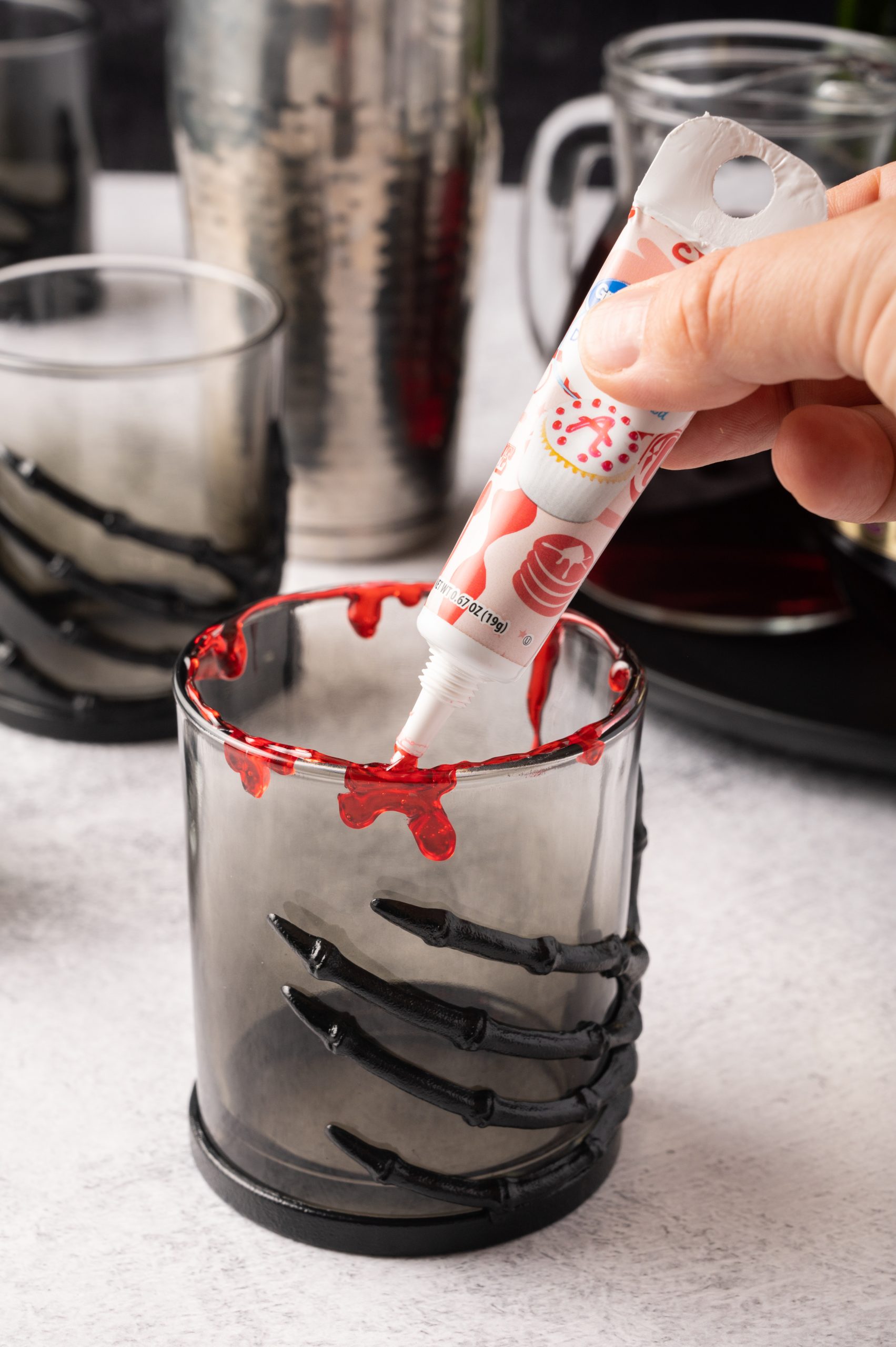 Use red icing to rim the glass, making it look like blood dripping down the sides